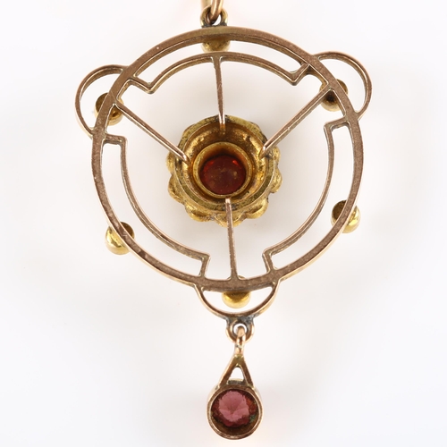 103 - An Edwardian garnet and pearl openwork pendant necklace, unmarked gold settings, on 9ct fine fancy l... 