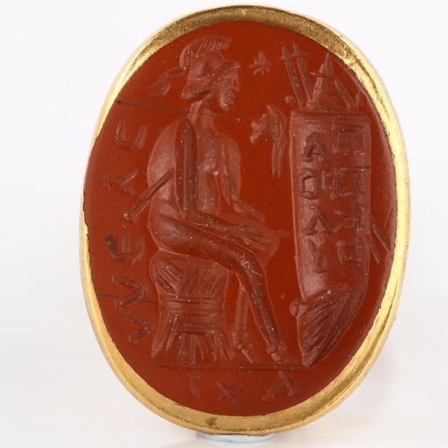 107 - An Ancient Roman red jasper ring stone, possibly depicting Minerva with scroll of text, intaglio car... 