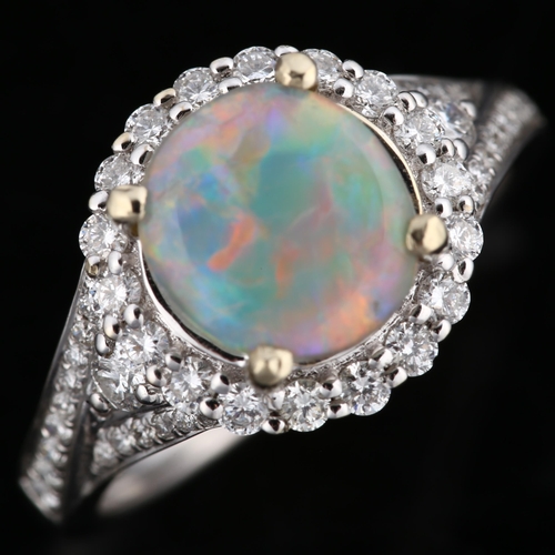 113 - An 18ct white gold lightning ridge opal and diamond cluster ring, set with circular cabochon opal an... 