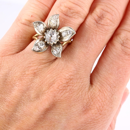 120 - A diamond flowerhead dress ring, unmarked gold and silver settings, set with old European and modern... 