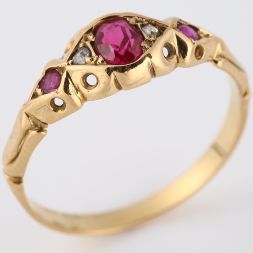 123 - An early 20th century ruby and diamond dress ring, unmarked gold settings with oval mixed-cut ruby a... 