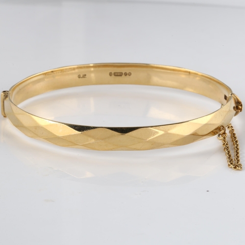 129 - A mid-20th century 9ct gold hinged bracelet, with faceted lozenge design, by Georg Jensen Ltd, hallm... 