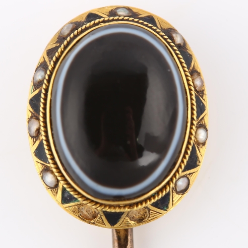 131 - A 19th century banded agate and pearl memorial stickpin, unmarked gold settings with oval cabochon a... 