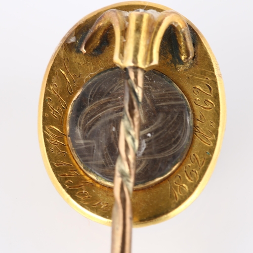 131 - A 19th century banded agate and pearl memorial stickpin, unmarked gold settings with oval cabochon a... 