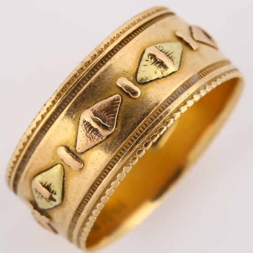 134 - A 19th century 18ct two-colour gold wedding band ring, with raised lozenge decoration and engraved b... 