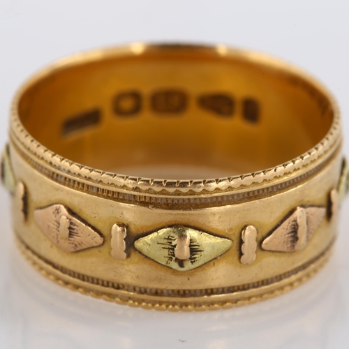 134 - A 19th century 18ct two-colour gold wedding band ring, with raised lozenge decoration and engraved b... 