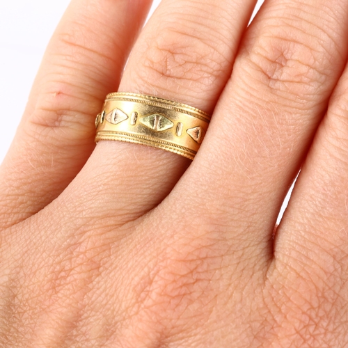 134 - A 19th century 18ct two-colour gold wedding band ring, with raised lozenge decoration and engraved b... 