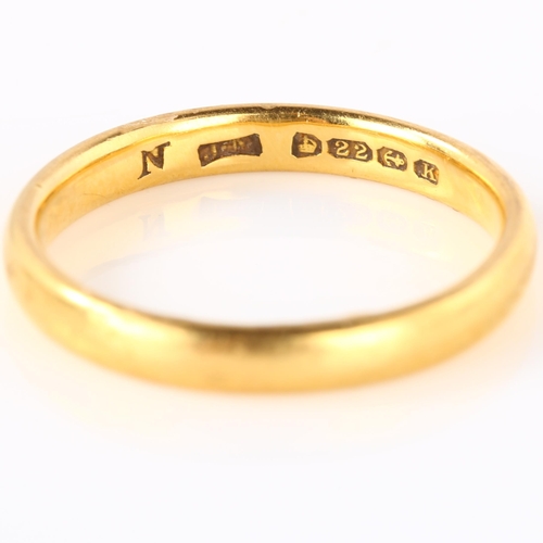 136 - An early 20th century 22ct gold wedding band ring, maker's marks JM, hallmarks Birmingham 1934, band... 