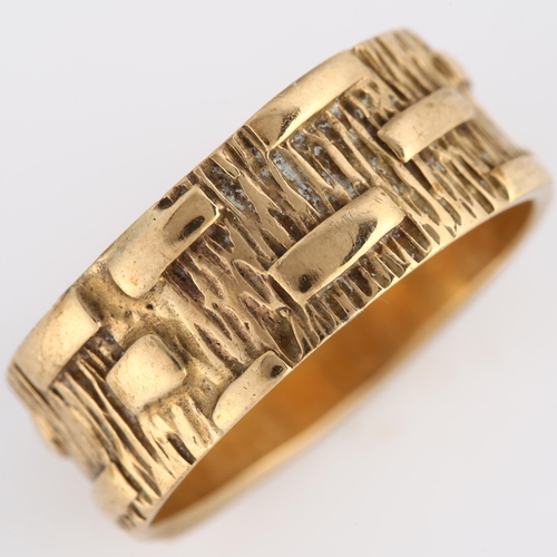 139 - A mid-20th century 9ct gold wedding band ring, textured bark and block design, maker's marks PLS, ha... 