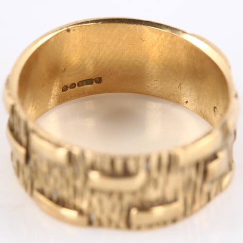 139 - A mid-20th century 9ct gold wedding band ring, textured bark and block design, maker's marks PLS, ha... 