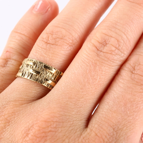 139 - A mid-20th century 9ct gold wedding band ring, textured bark and block design, maker's marks PLS, ha... 