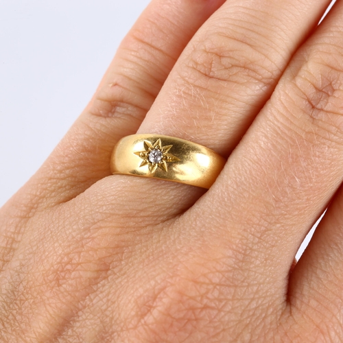 143 - An early 20th century 18ct gold solitaire diamond gypsy ring, set with 0.05ct old European-cut diamo... 