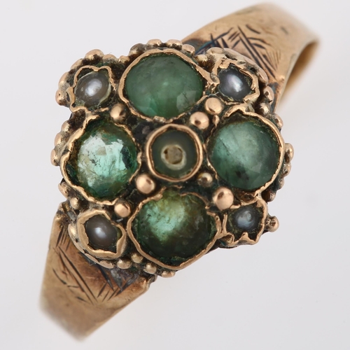 145 - A 19th century emerald and pearl quatrefoil dress ring, with engraved shoulders, unmarked gold setti... 