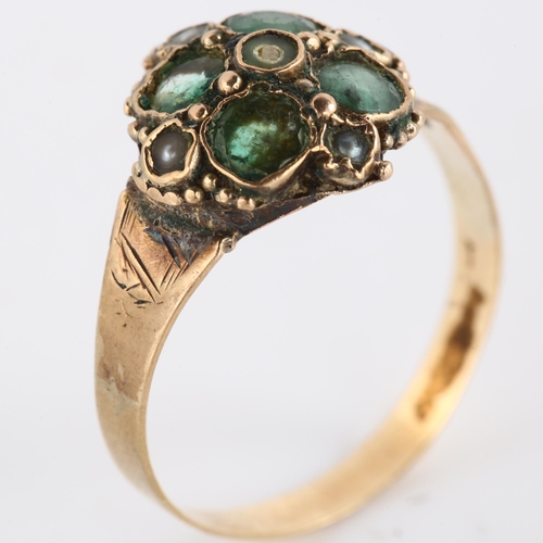 145 - A 19th century emerald and pearl quatrefoil dress ring, with engraved shoulders, unmarked gold setti... 