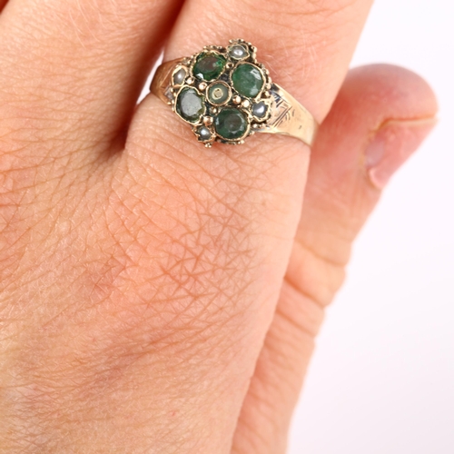 145 - A 19th century emerald and pearl quatrefoil dress ring, with engraved shoulders, unmarked gold setti... 