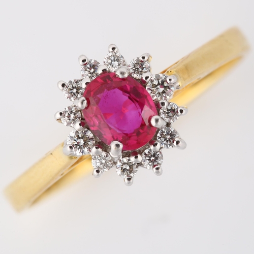 146 - A modern 18ct gold ruby and diamond cluster ring, set with oval mixed-cut ruby and modern round bril... 