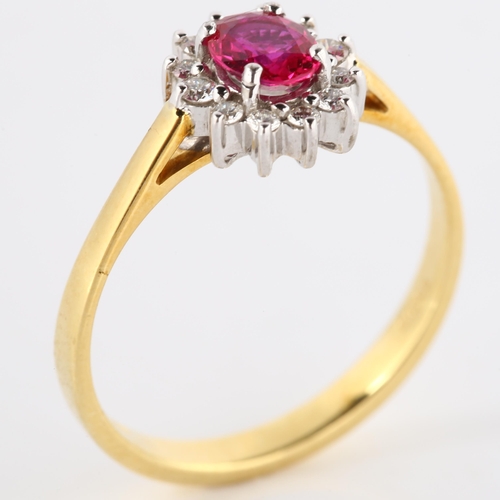 146 - A modern 18ct gold ruby and diamond cluster ring, set with oval mixed-cut ruby and modern round bril... 