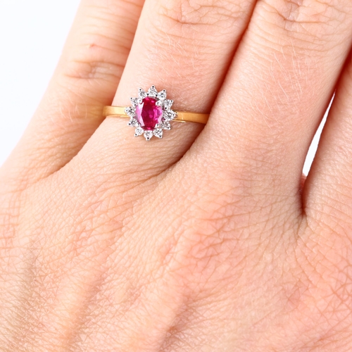 146 - A modern 18ct gold ruby and diamond cluster ring, set with oval mixed-cut ruby and modern round bril... 