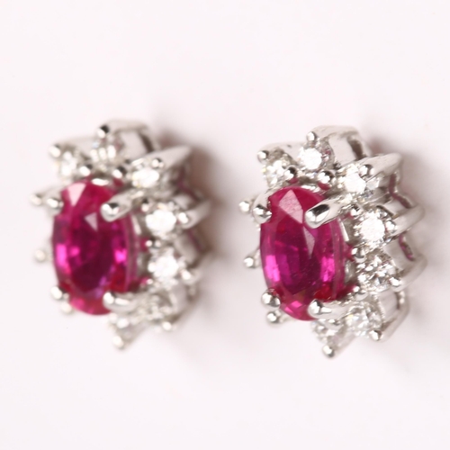 147 - A pair of 18ct gold ruby and diamond cluster earrings, set with oval mixed-cut ruby and modern round... 