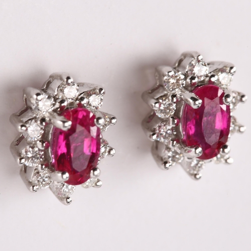 147 - A pair of 18ct gold ruby and diamond cluster earrings, set with oval mixed-cut ruby and modern round... 