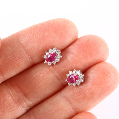 147 - A pair of 18ct gold ruby and diamond cluster earrings, set with oval mixed-cut ruby and modern round... 