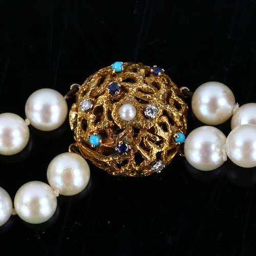 152 - A mid-20th century double-strand cultured pearl necklace, with 18ct gold gem set textured clasp, mak... 