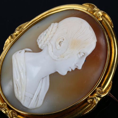 155 - A 19th century shell cameo brooch, depicting female profile with hair in large pluck under ear to br... 