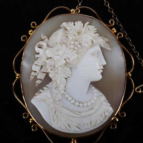 156 - A 19th century shell cameo brooch, depicting Dionysus, Greek God of Fertility, in 9ct gold scrollwor... 