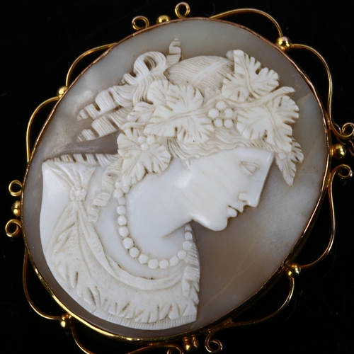 156 - A 19th century shell cameo brooch, depicting Dionysus, Greek God of Fertility, in 9ct gold scrollwor... 