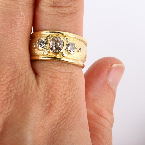 158 - An 18ct gold diamond band ring, in the style of Elizabeth Gage, set with old, modern round brilliant... 