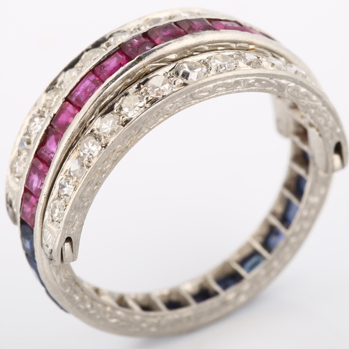 160 - An early 20th century 'Night and Day' ring, set with calibre-cut rubies and sapphires and rotating b... 