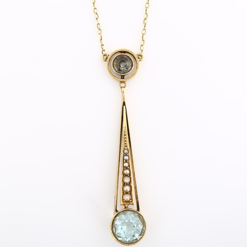 163 - An Edwardian 15ct gold aquamarine and pearl openwork pendant necklace, on 15ct fine cable link chain... 