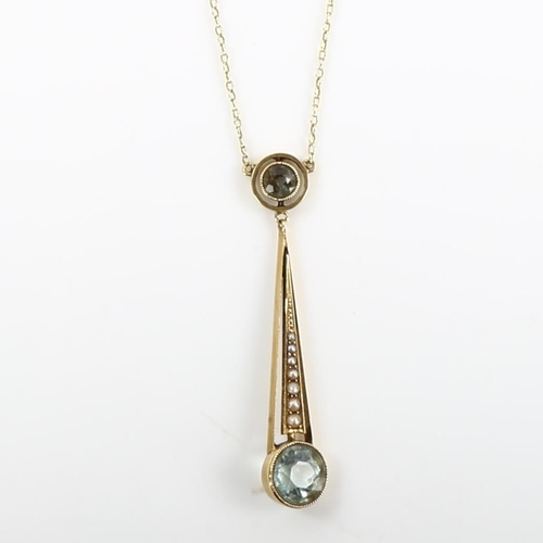 163 - An Edwardian 15ct gold aquamarine and pearl openwork pendant necklace, on 15ct fine cable link chain... 