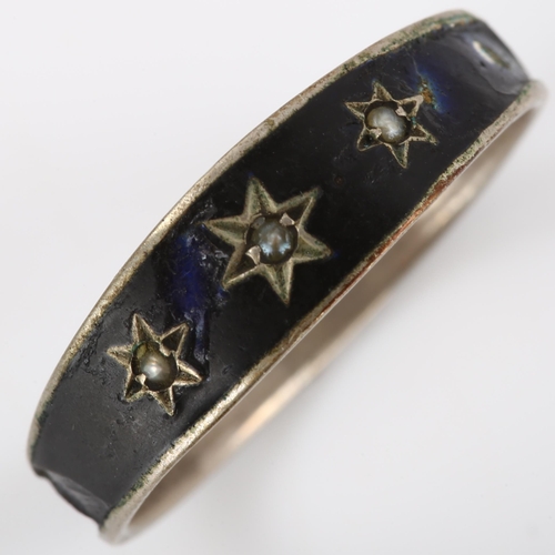 166 - A Victorian pearl memorial ring, unmarked white metal settings with black enamel decoration and star... 