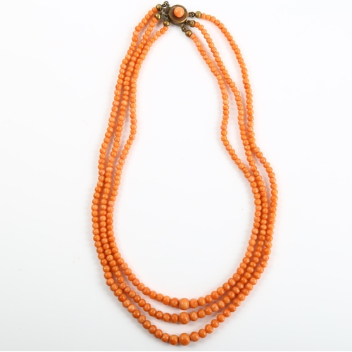 168 - A triple-strand graduated coral bead necklace, with gilt-metal clasp, beads ranging from 2.6mm to 6.... 