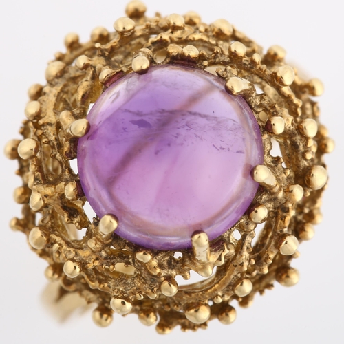 169 - A late 20th century 9ct gold amethyst bird's nest ring, set with round high cabochon amethyst within... 