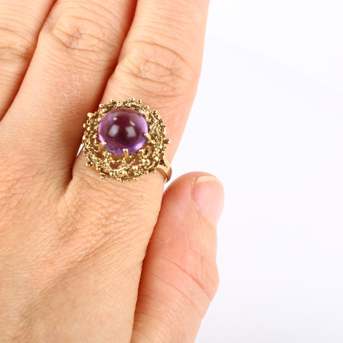 169 - A late 20th century 9ct gold amethyst bird's nest ring, set with round high cabochon amethyst within... 