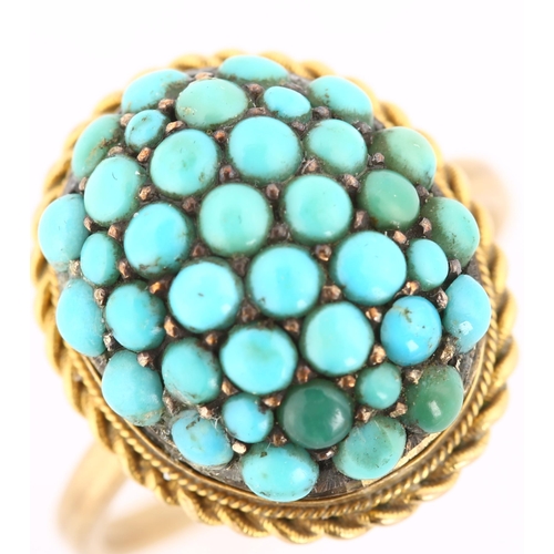 170 - An Antique turquoise bombe ring, unmarked gold settings with round cabochon turquoise and rope twist... 