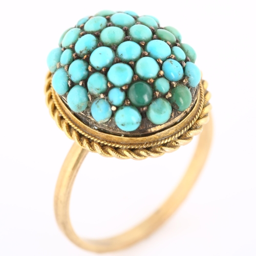 170 - An Antique turquoise bombe ring, unmarked gold settings with round cabochon turquoise and rope twist... 