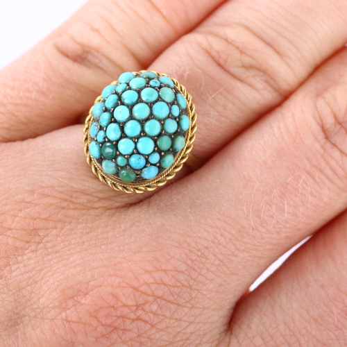 170 - An Antique turquoise bombe ring, unmarked gold settings with round cabochon turquoise and rope twist... 