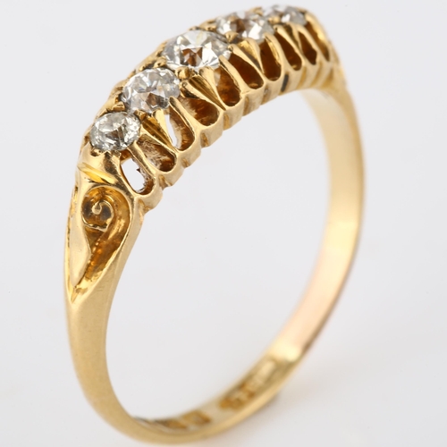 184 - An early 20th century 18ct gold graduated five stone diamond half hoop ring, set with old European-c... 