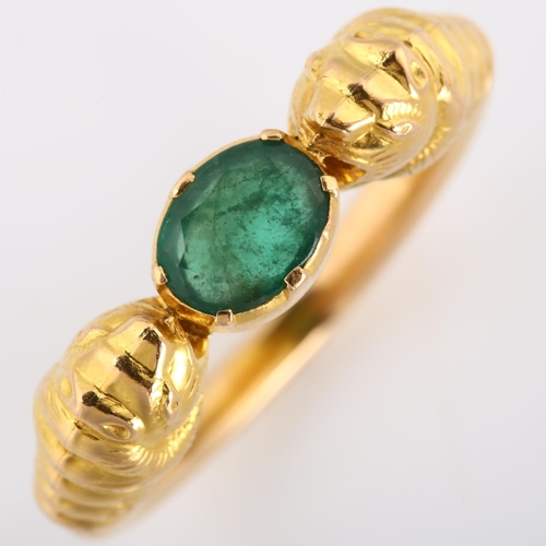 186 - A large 18ct gold emerald lion-head ring, after the Ancient Greek design, set with oval mixed-cut em... 