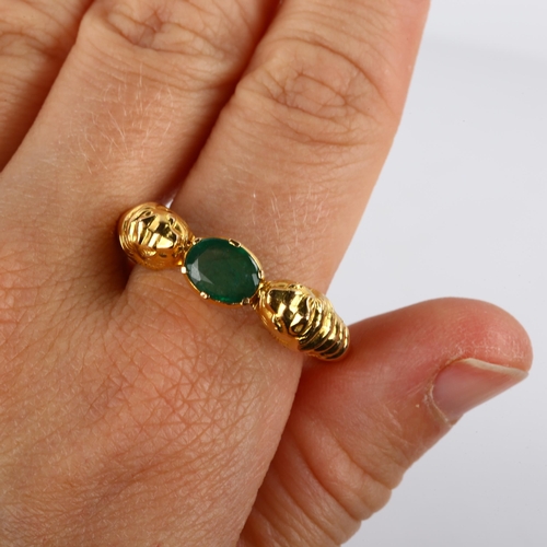 186 - A large 18ct gold emerald lion-head ring, after the Ancient Greek design, set with oval mixed-cut em... 