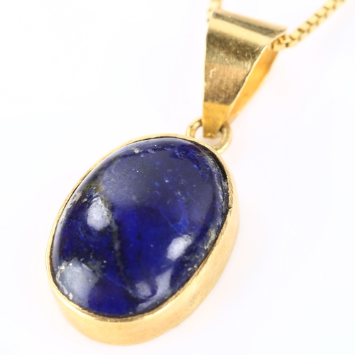 188 - An Egyptian lapis lazuli pendant necklace, unmarked high carat gold settings with oval cabochon lapi... 