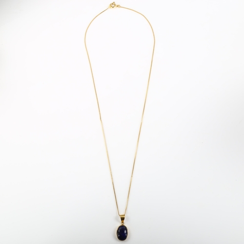 188 - An Egyptian lapis lazuli pendant necklace, unmarked high carat gold settings with oval cabochon lapi... 