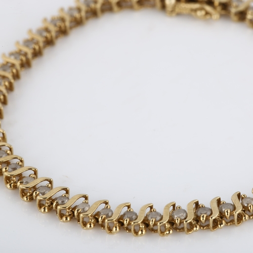 189 - A modern 9ct gold diamond tennis line bracelet, set with modern round brilliant-cut diamonds, total ... 