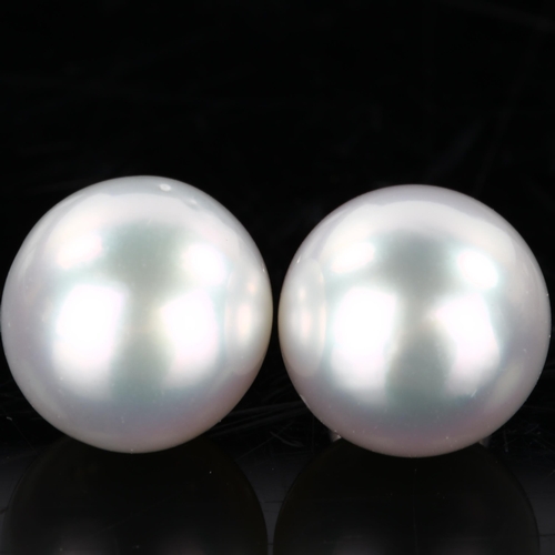 191 - A pair of 18ct white gold whole pearl earrings, set with 13.8mm pearls and stud fittings, hallmarks ... 