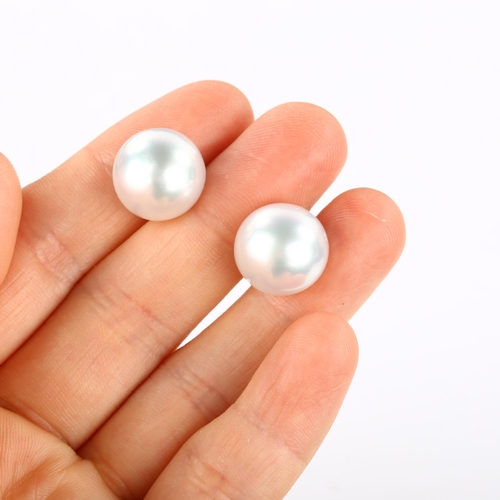 191 - A pair of 18ct white gold whole pearl earrings, set with 13.8mm pearls and stud fittings, hallmarks ... 