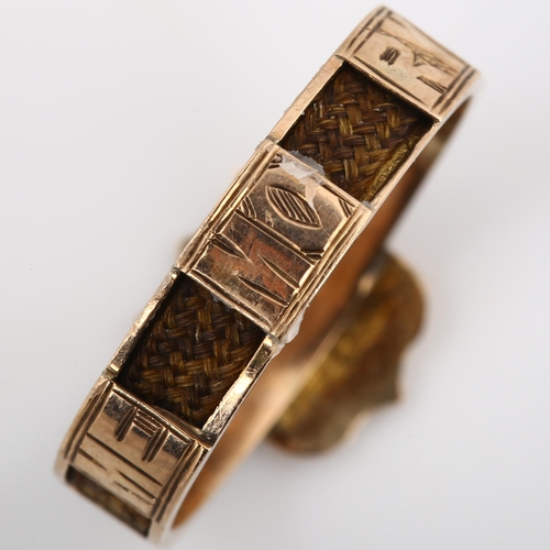 195 - An Antique 9ct rose gold memorial band ring, with shield motif and woven hair shank, inscribed 