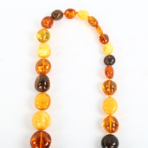 208 - A large graduated specimen amber bead necklace, beads ranging from 13mm to 35.6mm, necklace length 8... 